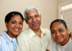 an elderly couple and a caregiver